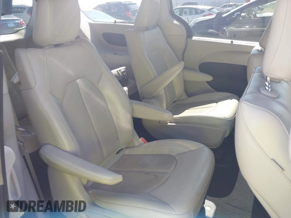 2021 Chrysler Pacifica Hybrid Touring L with VIN 2C4RC1L76MR594571, listed as a IAAI auction lot 40255745 with 58,163 mi miles and . Bid and sale history available at DreamBid. Image 8.