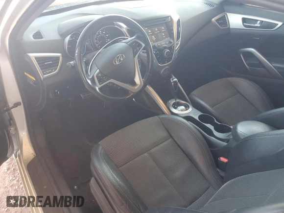 2014 Hyundai Veloster z VIN KMHTC6AD7EU216819, wystawiony jako Copart lot #57135335 z przebiegiem 104 588 mil mil oraz Szkoda całkowita • Salvage title. Historia ofert i sprzedaży dostępna na DreamBid. Obrazek 8.