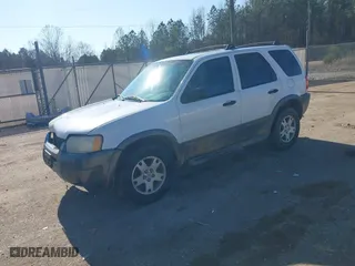 2004 Ford Escape XLT with VIN 1FMYU93174KA45992, listed as a IAAI auction lot 41169340 with 308,987 mi miles. Bid and sale history available at carsss.com. Image 2.