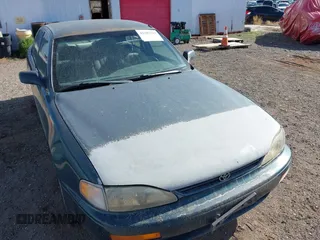 1996 Toyota Camry DX z VIN 4T1BG12K7TU661879, wystawiony jako IAAI lot #42203349 z przebiegiem 213 970 mil mil oraz . Historia ofert i sprzedaży dostępna na DreamBid. Obrazek 6.