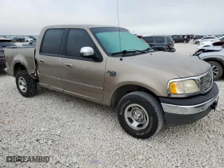 2001 Ford F-150 SuperCrew XLT with VIN 1FTRW07L21KF72022, listed as a Copart auction lot 69532204 with 205,793 mi miles and Salvage Title. Bid and sale history available at carsss.com. Image 4.