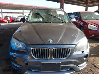 2013 BMW X1 28i with VIN WBAVM1C57DVW42096, listed as a IAAI auction lot 41572971 with 156,999 mi miles. Bid and sale history available at carsss.com. Image 11.