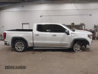 2020 GMC Sierra 1500 Denali z VIN 1GTU9FEL9LZ116486, wystawiony jako IAAI lot #41392384 z przebiegiem 61 283 mil mil oraz . Historia ofert i sprzedaży dostępna na DreamBid. Obrazek 13.