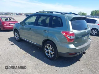 2016 Subaru Forester Touring with VIN JF2SJAVCXGH490507, listed as a IAAI auction lot 42070715 with 98,456 mi miles and . Bid and sale history available at DreamBid. Image 3.