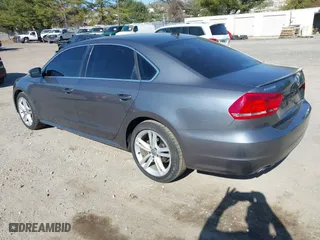 2013 Volkswagen Passat SE w/Sunroof with VIN 1VWBM7A30DC125919, listed as a IAAI auction lot 41759051 with 112,952 mi miles. Bid and sale history available at carsss.com. Image 3.