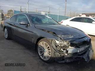 2014 BMW 4 Series 428i with VIN WBA3N7C5XEF719384, listed as a IAAI auction lot 41694678 with 115,517 mi miles and . Bid and sale history available at carsss.com. Image 1.