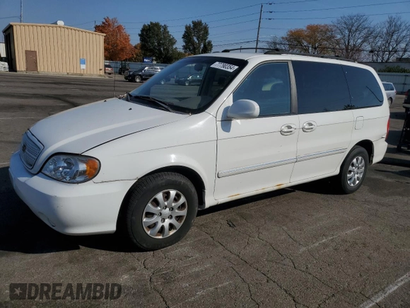 2005 Kia Sedona LX with VIN KNDUP132056685525, listed as a Copart auction lot 77790354 with 60,985 mi miles and Salvage Title. Bid and sale history available at carsss.com. Image 1.