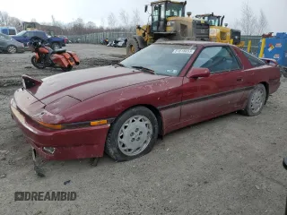 1987 Toyota Supra z VIN JT2MA71J4H0068594, wystawiony jako Copart lot #81918653 z przebiegiem 91 630 mil mil oraz Szkoda całkowita • Salvage title. Historia ofert i sprzedaży dostępna na DreamBid. Obrazek 1.