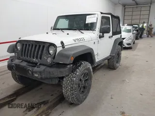 2016 Jeep Wrangler Sport with VIN 1C4AJWAG9GL261958, listed as a IAAI auction lot 41595490 with 32,433 mi miles and . Bid and sale history available at carsss.com. Image 2.