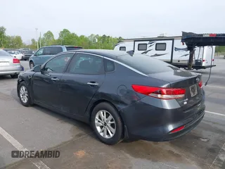 2016 Kia Optima LX with VIN KNAGT4L33G5107444, listed as a IAAI auction lot 41971006 with 174,997 mi miles. Bid and sale history available at carsss.com. Image 3.
