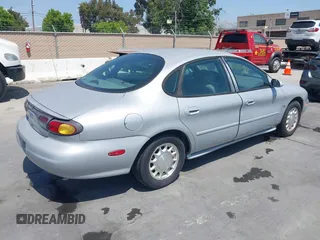 1996 Ford Taurus LX with VIN 1FALP53S5TG199843, listed as a IAAI auction lot 42430761 with 95,984 mi miles and . Bid and sale history available at DreamBid. Image 4.