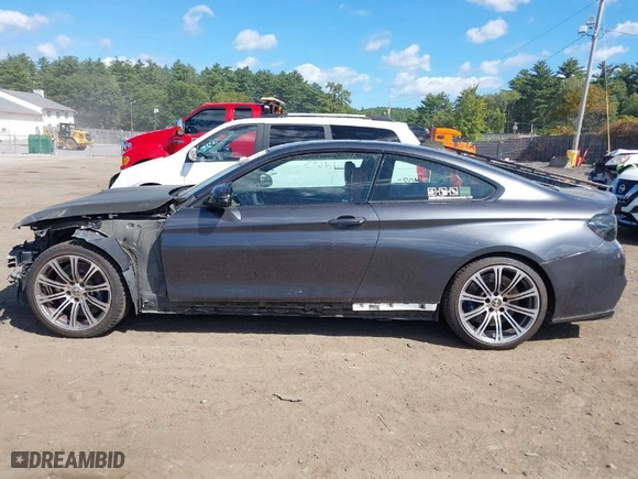 2015 BMW M4 with VIN WBS3R9C51FK333490, listed as a IAAI auction lot 40217693 with NaN miles. Bid and sale history available at carsss.com. Image 15.