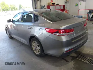 2018 Kia Optima S with VIN 5XXGT4L35JG209561, listed as a IAAI auction lot 42526577 with 161,906 mi miles and . Bid and sale history available at DreamBid. Image 3.