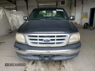 1999 Ford F-150 with VIN 1FTZX1723XNA24144, listed as a Copart auction lot 58071155 with 320,829 mi miles and Salvage title. Bid and sale history available at DreamBid. Image 5.