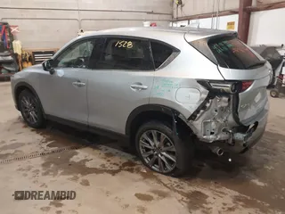 2021 Mazda CX-5 Grand Touring with VIN JM3KFADMXM1318015, listed as a IAAI auction lot 41221528 with 79,473 mi miles. Bid and sale history available at carsss.com. Image 3.