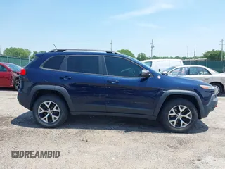 2015 Jeep Cherokee Trailhawk with VIN 1C4PJMBS3FW704622, listed as a IAAI auction lot 42465702 with 96,831 mi miles and . Bid and sale history available at DreamBid. Image 13.