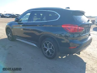 2018 BMW X1 sDrive28i with VIN WBXHU7C37J5H43318, listed as a IAAI auction lot 41294730 with 73,600 mi miles. Bid and sale history available at carsss.com. Image 3.