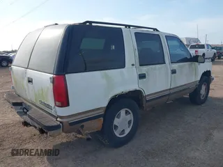 1997 Chevrolet Tahoe z VIN 1GNEK13R3VJ416827, wystawiony jako IAAI lot #42041780 z przebiegiem 143 566 mil mil oraz . Historia ofert i sprzedaży dostępna na DreamBid. Obrazek 4.