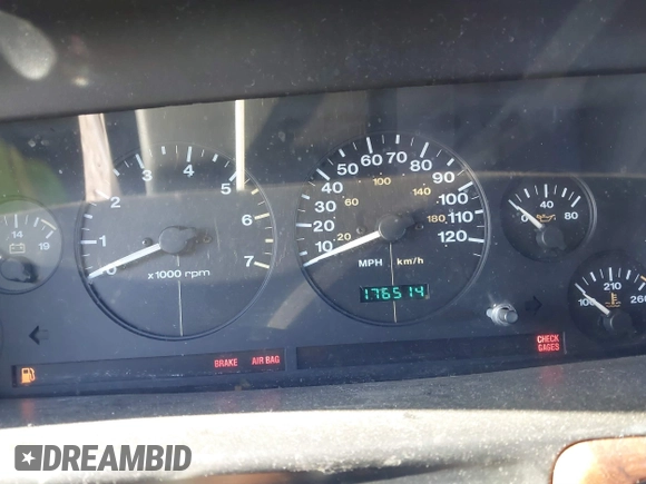 1997 Jeep Grand Cherokee Laredo with VIN 1J4GZ58SXVC687950, listed as a IAAI auction lot 40978411 with 176,514 mi miles. Bid and sale history available at carsss.com. Image 7.