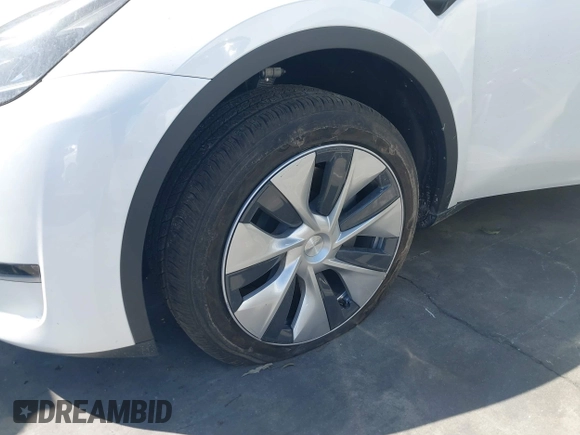 2024 Tesla Model Y with VIN 7SAYGDED2RF017448, listed as a IAAI auction lot 41597056 with 9,702 mi miles and . Bid and sale history available at DreamBid. Image 23.