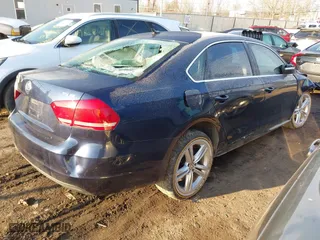 2015 Volkswagen Passat 2.0L TDI SE w/Sunroof with VIN 1VWBV7A34FC021031, listed as a IAAI auction lot 41601548 with 173,402 mi miles. Bid and sale history available at carsss.com. Image 4.
