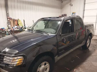 2001 Ford Explorer Sport Trac z VIN 1FMZU77E21UC84338, wystawiony jako IAAI lot #41420422 z przebiegiem 218 094 mil mil oraz . Historia ofert i sprzedaży dostępna na DreamBid. Obrazek 6.