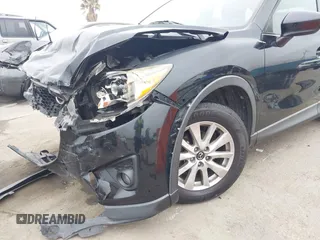 2014 Mazda CX-5 Touring z VIN JM3KE2CY3E0355332, wystawiony jako IAAI lot #42096306 z przebiegiem 108 198 mil mil oraz . Historia ofert i sprzedaży dostępna na DreamBid. Obrazek 16.