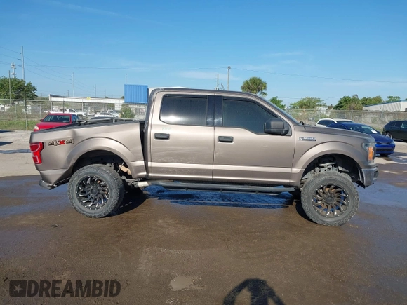 2018 Ford F-150 XL with VIN 1FTEW1EG1JFC31794, listed as a IAAI auction lot 41304111 with 129,058 mi miles and . Bid and sale history available at carsss.com. Image 13.