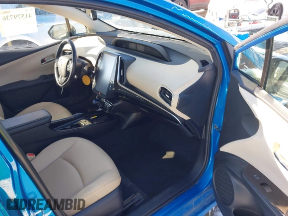 2021 Toyota Prius L Eco with VIN JTDKAMFU9M3135117, listed as a IAAI auction lot 41579736 with 35,795 mi miles and . Bid and sale history available at DreamBid. Image 5.