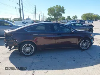 2019 Ford Fusion Hybrid Titanium with VIN 3FA6P0RU2KR123786, listed as a IAAI auction lot 41857026 with 49,604 mi miles. Bid and sale history available at carsss.com. Image 14.