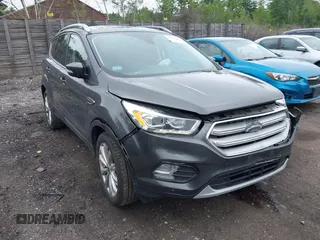 2018 Ford Escape Titanium with VIN 1FMCU9J93JUB18374, listed as a IAAI auction lot 42652204 with 63,609 mi miles and . Bid and sale history available at DreamBid. Image 1.