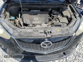 2014 Mazda CX-5 Touring z VIN JM3KE2CY8E0326988, wystawiony jako Copart lot #60473715 z przebiegiem 231 055 mil mil oraz Czysty tytuł • Clean title. Historia ofert i sprzedaży dostępna na DreamBid. Obrazek 12.