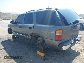 2001 Chevrolet Tahoe LS z VIN 1GNEC13T51J153677, wystawiony jako IAAI lot #42459552 z przebiegiem 201 209 mil mil oraz . Historia ofert i sprzedaży dostępna na DreamBid. Obrazek 3.