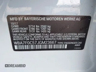 2018 BMW 7 Series 750i with VIN WBA7F0C57JGM23667, listed as a IAAI auction lot 41581035 with 113,140 mi miles and . Bid and sale history available at DreamBid. Image 9.
