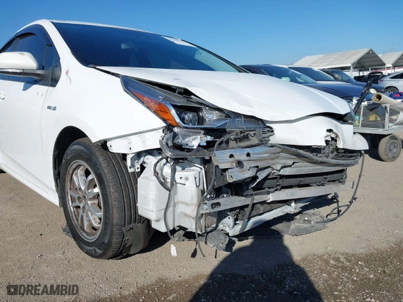 2021 Toyota Prius L Eco with VIN JTDKAMFU7M3148089, listed as a IAAI auction lot 41614915 with 119,725 mi miles. Bid and sale history available at carsss.com. Image 6.