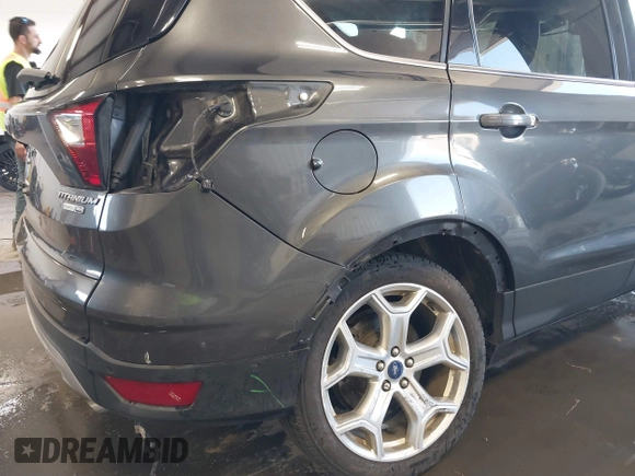 2019 Ford Escape Titanium with VIN 1FMCU9J97KUC55772, listed as a IAAI auction lot 42514001 with 77,737 mi miles and . Bid and sale history available at DreamBid. Image 6.
