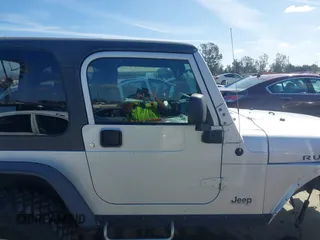 2004 Jeep Wrangler Rubicon with VIN 1J4FA69S94P701660, listed as a IAAI auction lot 41699554 with 74,640 mi miles. Bid and sale history available at carsss.com. Image 14.