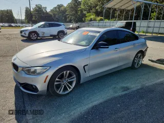 2015 BMW 4 Series 428i with VIN WBA4A5C58FD410952, listed as a Copart auction lot 61150405 with 162,412 mi miles and Salvage title. Bid and sale history available at DreamBid. Image 1.