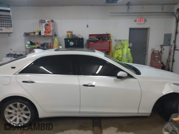 2015 Cadillac CTS Luxury AWD with VIN 1G6AX5SX5F0117267, listed as a IAAI auction lot 41762217 with 79,930 mi miles and . Bid and sale history available at DreamBid. Image 14.