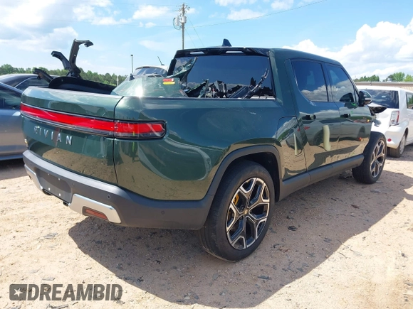 2023 Rivian R1T Adventure z VIN 7FCTGAAAXPN019894, wystawiony jako IAAI lot #42168226 z przebiegiem 23 380 mil mil oraz . Historia ofert i sprzedaży dostępna na DreamBid. Obrazek 4.