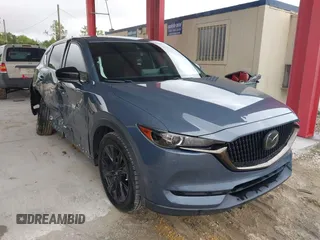 2021 Mazda CX-5 Touring with VIN JM3KFACM0M0327832, listed as a IAAI auction lot 41989199 with 42,396 mi miles. Bid and sale history available at carsss.com. Image 1.