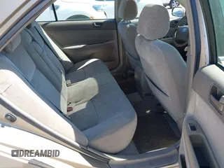 2002 Toyota Camry XLE z VIN 4T1BF30K82U018974, wystawiony jako IAAI lot #41712857 z przebiegiem 236 353 mil mil oraz . Historia ofert i sprzedaży dostępna na DreamBid. Obrazek 8.