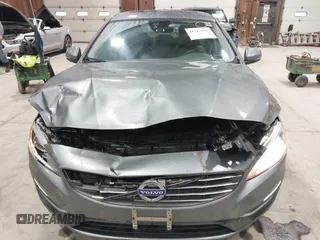 2016 Volvo S60 T5 Premier z VIN YV1612TK0G2410743, wystawiony jako IAAI lot #41717318 z przebiegiem 87 087 mil mil oraz . Historia ofert i sprzedaży dostępna na DreamBid. Obrazek 6.