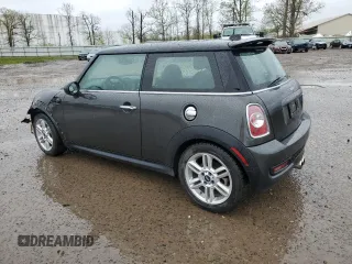 2013 MINI Hardtop S with VIN WMWSV3C50DT477984, listed as a Copart auction lot 56190855 with 98,878 mi miles and Salvage Title. Bid and sale history available at DreamBid. Image 2.
