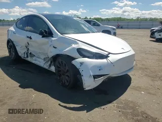 2022 Tesla Model Y Performance with VIN 7SAYGDEF9NF372337, listed as a Copart auction lot 55889345 with 51,099 mi miles and Salvage title. Bid and sale history available at DreamBid. Image 13.