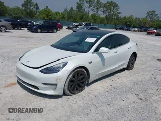 2019 Tesla Model 3 Long Range with VIN 5YJ3E1EB4KF494432, listed as a IAAI auction lot 42009327 with 121,954 mi miles and . Bid and sale history available at DreamBid. Image 2.