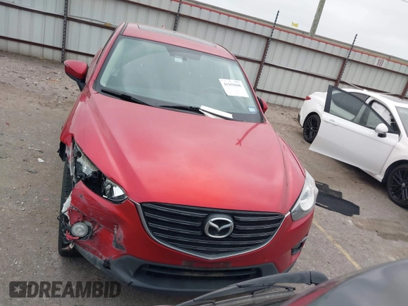 2016 Mazda CX-5 Grand Touring with VIN JM3KE2DY8G0871574, listed as a IAAI auction lot 41959686 with 95,416 mi miles and . Bid and sale history available at DreamBid. Image 12.