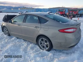 2016 Ford Fusion SE Hybrid with VIN 3FA6P0LU8GR127311, listed as a IAAI auction lot 41242945 with 1 mi miles. Bid and sale history available at carsss.com. Image 3.