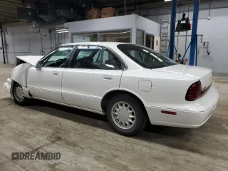 1998 Oldsmobile 88 LS z VIN 1G3HN52K9W4823866, wystawiony jako Copart lot #49150535 z przebiegiem 54 125 mil mil oraz Szkody całkowita. Historia ofert i sprzedaży dostępna na DreamBid. Obrazek 2.
