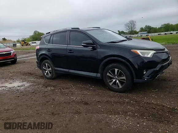 2018 Toyota RAV4 XLE with VIN 2T3WFREV0JW484430, listed as a Copart auction lot 55878455 with 132,335 mi miles and Salvage title. Bid and sale history available at DreamBid. Image 14.
